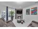 Cozy living area with a TV over the fireplace, tile floors, and a comfortable gray sectional at 545 Woodland Park Ter, Lawrenceville, GA 30043