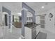 Open concept living space with granite counter, white cabinets, view of the main living room at 545 Woodland Park Ter, Lawrenceville, GA 30043