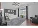 A spacious bedroom boasts a modern white platform bed, vaulted ceilings, and sleek decor at 545 Woodland Park Ter, Lawrenceville, GA 30043