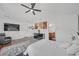 This relaxing main bedroom with a ceiling fan and plenty of space for comfort at 545 Woodland Park Ter, Lawrenceville, GA 30043