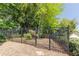 A fenced backyard with mature trees at 902 Lenox Hill Ne Ct, Atlanta, GA 30324