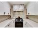 Kitchen with white cabinets, quartz countertops, and stainless steel appliances at 902 Lenox Hill Ne Ct, Atlanta, GA 30324