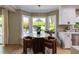 Bright eat-in kitchen with stainless appliances, white cabinets, bay window with a view to the backyard at 902 Lenox Hill Ne Ct, Atlanta, GA 30324