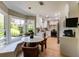 Bright eat-in kitchen featuring a window seat, marble table, and stainless steel appliances at 902 Lenox Hill Ne Ct, Atlanta, GA 30324