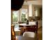 Eat-in kitchen nook features an updated light fixture, white cabinets and a view of the outdoors at 902 Lenox Hill Ne Ct, Atlanta, GA 30324