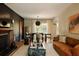 Spacious living room with fireplace, hardwood floors, and large windows providing natural light at 902 Lenox Hill Ne Ct, Atlanta, GA 30324
