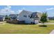 View of the home's backyard featuring a lush lawn and a privacy fence at 113 Cottage Walk, Cartersville, GA 30121