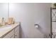 Bathroom featuring a granite countertop, white cabinetry, and wall-mounted fixtures at 113 Cottage Walk, Cartersville, GA 30121