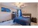 Comfortable bedroom featuring a plush bed, dresser, and decoratively lined up shoes along the wall at 113 Cottage Walk, Cartersville, GA 30121