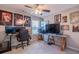 A creative and cozy bedroom with a ceiling fan, carpet and multiple decoratives hanging on the wall at 113 Cottage Walk, Cartersville, GA 30121