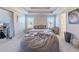 A comfortable bedroom is equipped with a suspended ceiling fan, a bed, and a gray bean bag at 113 Cottage Walk, Cartersville, GA 30121