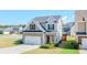 Charming two-story home with stone accents, a two-car garage, and a well-manicured lawn at 113 Cottage Walk, Cartersville, GA 30121