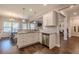 Well-lit kitchen featuring white cabinetry, granite countertops, and stainless steel appliances at 113 Cottage Walk, Cartersville, GA 30121