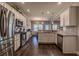 Spacious kitchen with stainless steel appliances, white cabinetry, and open layout at 113 Cottage Walk, Cartersville, GA 30121