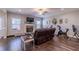 Spacious living room featuring hardwood floors and a modern fireplace at 113 Cottage Walk, Cartersville, GA 30121