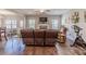 Open-concept living room with hardwood floors and a view of the adjacent dining area at 113 Cottage Walk, Cartersville, GA 30121