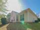 Backyard featuring a house with an arched window, an air conditioner, and a small deck at 334 Royal Crescent Way, Stockbridge, GA 30281