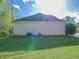 Backyard featuring healthy green grass and the home's HVAC unit at 334 Royal Crescent Way, Stockbridge, GA 30281