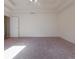 A spacious bedroom featuring carpet floors, a ceiling fan, and tray ceilings at 334 Royal Crescent Way, Stockbridge, GA 30281