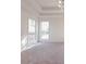 Bright bedroom with carpet flooring, a ceiling fan, and two windows that let in plenty of natural light at 334 Royal Crescent Way, Stockbridge, GA 30281