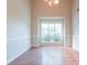 Dining room featuring hardwood floors, chair railing, and a window providing natural light at 334 Royal Crescent Way, Stockbridge, GA 30281