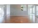Open living room area with hardwood flooring and views to other rooms at 334 Royal Crescent Way, Stockbridge, GA 30281