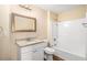 Clean bathroom features granite countertop, vanity, tub-shower combo, and vinyl floor at 45 Chapman Way, Covington, GA 30016