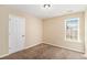 Cozy bedroom featuring neutral walls, carpet floor, and ample natural light at 45 Chapman Way, Covington, GA 30016