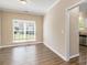 Dining area with hardwood floors, large windows, and neutral walls at 45 Chapman Way, Covington, GA 30016
