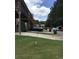 Backyard, parking area and deck structure on stilts at 6158 Thorncrest Dr, Tucker, GA 30084