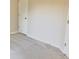 Bright, spacious bedroom with neutral carpeting and large doors, perfect for a minimalistic design at 6158 Thorncrest Dr, Tucker, GA 30084
