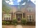 Traditional two-story brick home with charming curb appeal, showcasing a welcoming front entrance at 6158 Thorncrest Dr, Tucker, GA 30084