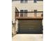 Exterior shot showing the garage and an elevated deck above it at 6158 Thorncrest Dr, Tucker, GA 30084