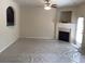 Bright living room features a fireplace, ceiling fan and a door leading to the backyard at 6158 Thorncrest Dr, Tucker, GA 30084