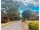 A wide street view displaying well-maintained lawns and mature trees in a peaceful neighborhood setting at 6158 Thorncrest Dr, Tucker, GA 30084