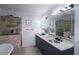 Luxurious bathroom with double vanity, elegant fixtures, and a separate tiled shower at 2277 Peachtree Ne Rd # 507, Atlanta, GA 30309