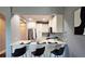 Charming kitchen with breakfast bar, white cabinetry, stainless steel appliances, and modern finishes at 2277 Peachtree Ne Rd # 507, Atlanta, GA 30309