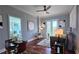 Elegant living room with hardwood floors, stylish furnishings, and a view into a bedroom at 2277 Peachtree Ne Rd # 507, Atlanta, GA 30309