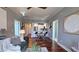 Cozy living room featuring hardwood floors, modern decor, and an open layout to the kitchen at 2277 Peachtree Ne Rd # 507, Atlanta, GA 30309