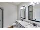 This bathroom features a double sink with granite countertops and black fixtures at 1765 Harmony Rd, Temple, GA 30179