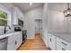 Kitchen features granite countertops, white cabinetry and stainless steel appliances at 1765 Harmony Rd, Temple, GA 30179