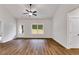 Open living room boasts wood-look flooring and plenty of natural light at 1765 Harmony Rd, Temple, GA 30179