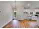 Open floor plan with modern kitchen appliances and hardwood floors at 1765 Harmony Rd, Temple, GA 30179