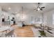 Bright and airy living space featuring stainless steel appliances, modern accents, and wood flooring at 1765 Harmony Rd, Temple, GA 30179