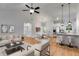 Open-concept living space with modern furnishings, vaulted ceiling, and wood flooring at 1765 Harmony Rd, Temple, GA 30179