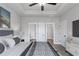 Spacious main bedroom featuring tray ceiling, and an ensuite bathroom with closet at 1765 Harmony Rd, Temple, GA 30179