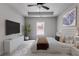 Cozy main bedroom with decorative tray ceiling, plush carpeting, and ample natural light at 1765 Harmony Rd, Temple, GA 30179