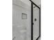 Walk-in shower features gray tile, a black shower head, and a built-in shelf at 1765 Harmony Rd, Temple, GA 30179