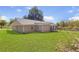 Exterior view of a home with a large, grassy backyard and a fenced-in area at 3556 Riley Rd, Douglasville, GA 30134