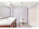 Bathroom featuring tile floors, a large sink, a toilet and a bath with shower at 3556 Riley Rd, Douglasville, GA 30134
